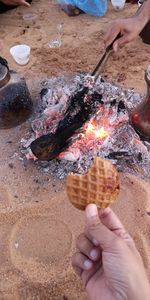 Cropped image of hand holding ice cream