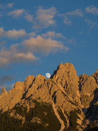 Low angle view of rock formations against sky