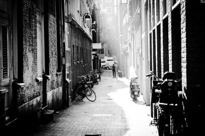 Narrow street amidst buildings in city