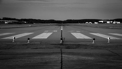 Runway at airport against sky