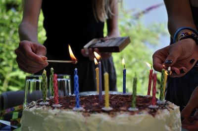 A girl lights candles