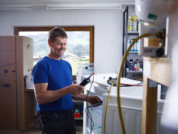 Side view of man working at home