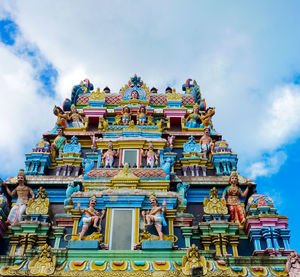 Low angle view of temple against building