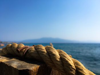 View of calm sea against clear blue sky