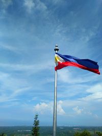 Low angle view of flag against sky