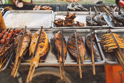 High angle view of grilled fishes for sale at market