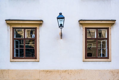 Low angle view of street light against building