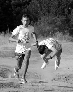 Full length of a boy playing on land