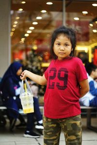 Portrait of girl standing in store