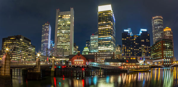 Illuminated city buildings at night