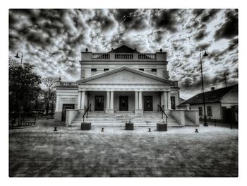 Building against cloudy sky