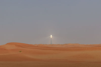 Scenic view of desert against clear sky