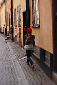 Full length of woman walking in tunnel