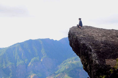 Woman on mountain top