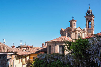 View of buildings against blue sky