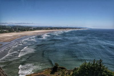 Scenic view of sea against clear blue sky