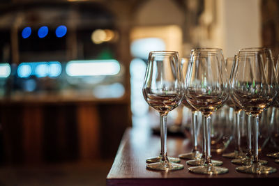 Close-up of wine glasses on table