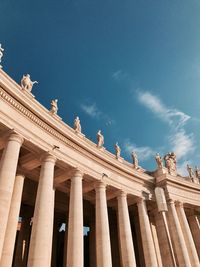 Low angle view of statue against blue sky