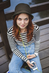 Portrait of young woman using mobile phone