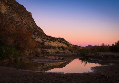Scenic view of lake against sky during sunset in big bend national park - texas
