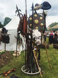 Traditional windmill on field against sky