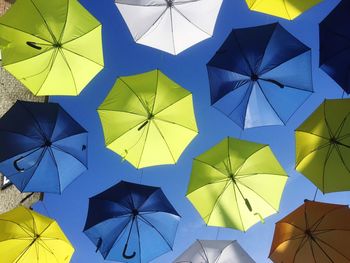 Colorful umbrellas hanging in row