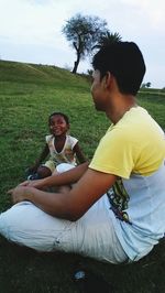 Friends sitting on field