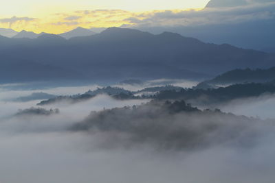 Scenic view of mountains against sky during sunset