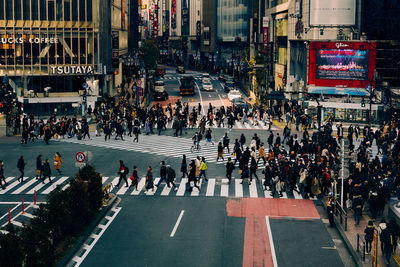 High angle view of people crossing road