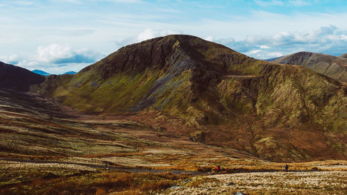Scenic view of landscape and mountains against sky