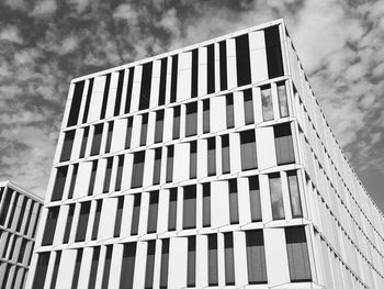 Low angle view of building against cloudy sky