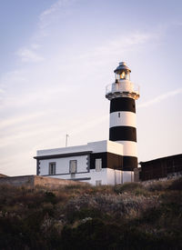 The lighthouse of capo sant'elia in cagliari sardinia at sunrise