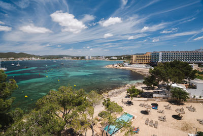 View of the beach and hotels on shore, ibiza island, spain