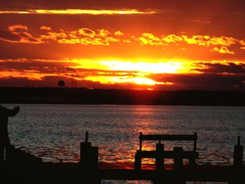 Scenic view of sea against orange sky