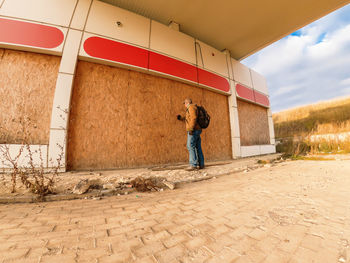 Man knocks on the closed door of a closed shop