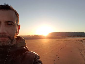 Portrait of man against sky during sunset