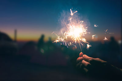 Close-up of sparkler at night