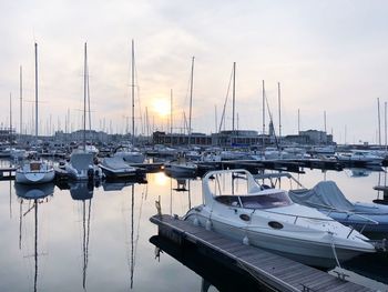 Boats moored at harbor