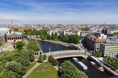 High angle view of road by buildings against sky