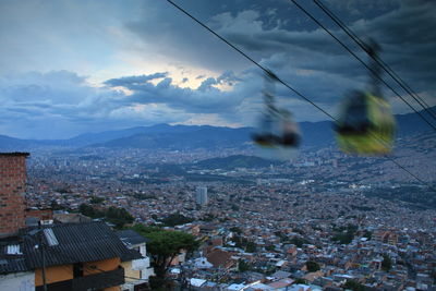 Aerial view of cityscape against sky