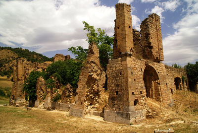 Old ruins against cloudy sky