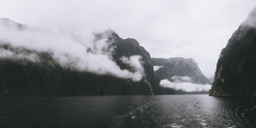 Panoramic view of milford sound fjord during foggy weather, nz