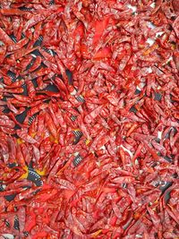 Full frame shot of red chili peppers for sale in market