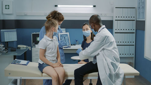 Female doctor examining x-ray in laboratory