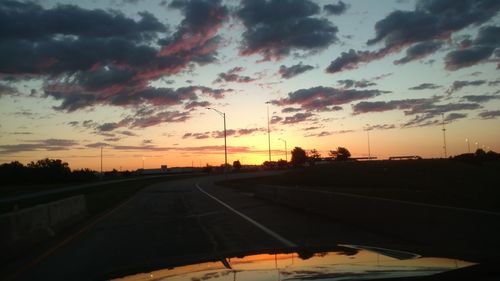 Road against dramatic sky during sunset