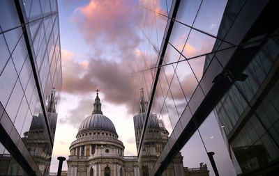 Low angle view of buildings against sky during sunset