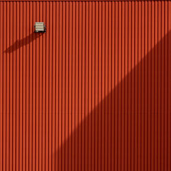 Illuminated red metal wall