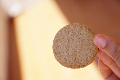 Close-up of hand holding ice cream