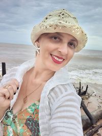 Portrait of a smiling woman on beach
