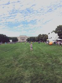 People on field against sky